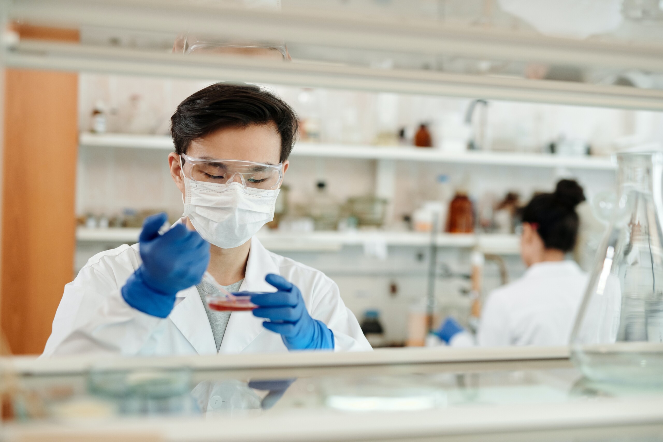 Man in lab with petri dish