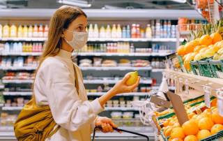 Woman wearing mask in grocery store